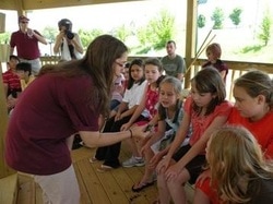 Educator with children at the Wetland Center